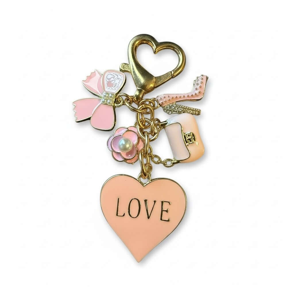 Legacy Blush Love Charm featuring a pastel pink heart, bow, pearl blossom, stiletto, and mini purse.