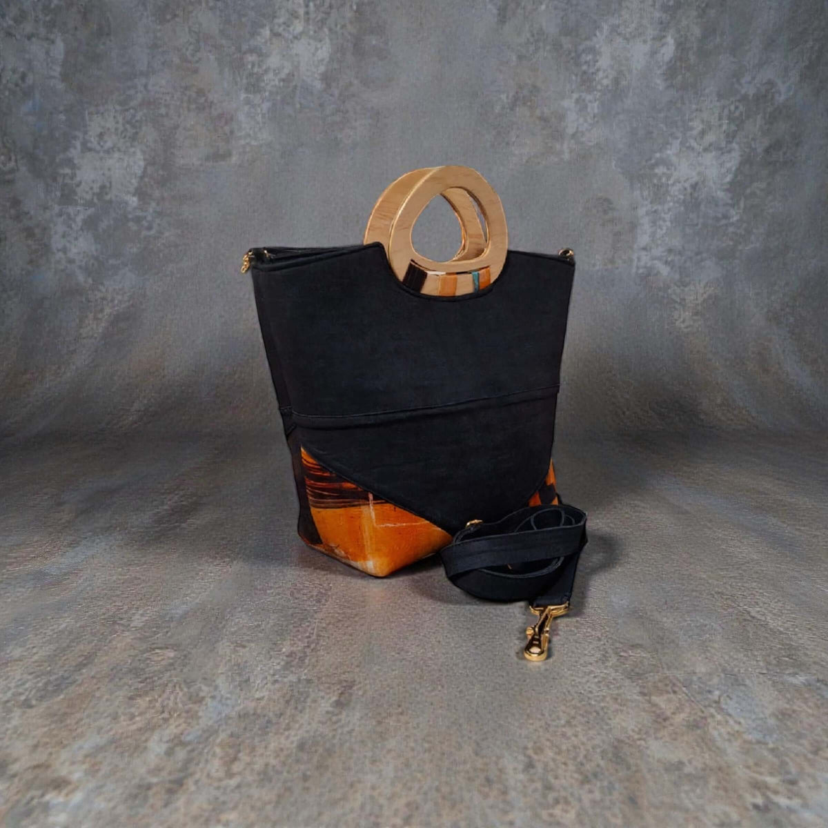 Dana Denim Artisan Handbag – Custom Handcrafted Denim & Wood Handle Bag with detachable strap on textured background.