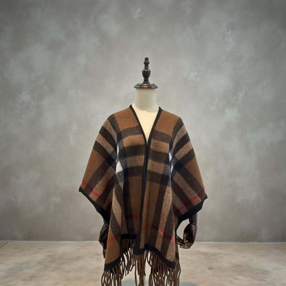 Heritage Plaid Luxe Poncho Shawl – One Size Cozy Fringe Wrap in rich brown plaid with fringe hem displayed on mannequin.
