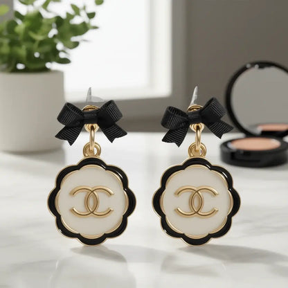 Noir Bow Cameo Upcycled Statement Earrings – One of One featuring elegant black bows and chic cameo design.