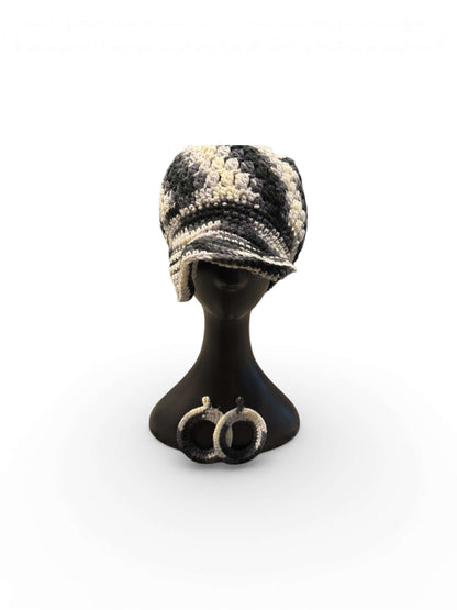 Stone & Smoke Crochet Crown Set- Stone & Smoke - One of One displayed on a mannequin, featuring a crochet cap and statement earrings.