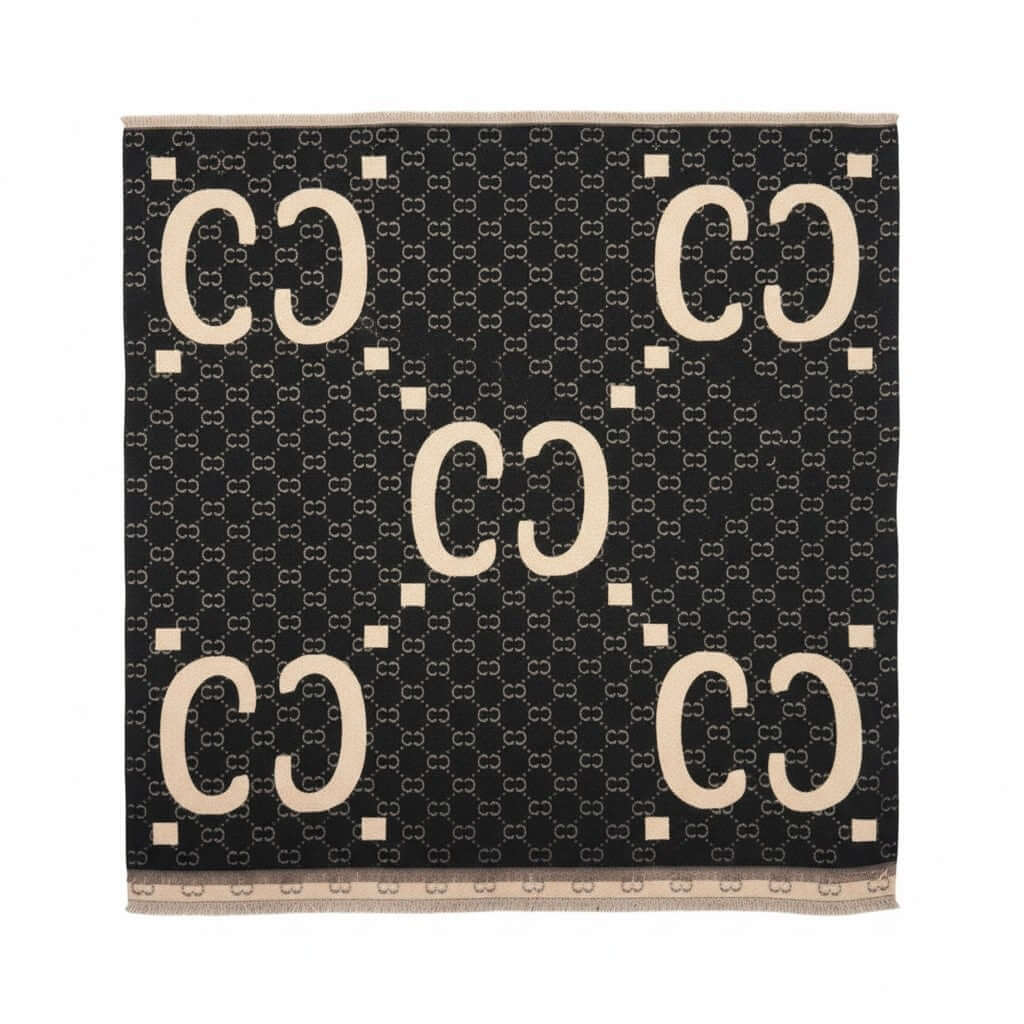 Legacy Luxe Icon Weave Wrap featuring a bold signature pattern in black and beige, perfect for stylish layering.
