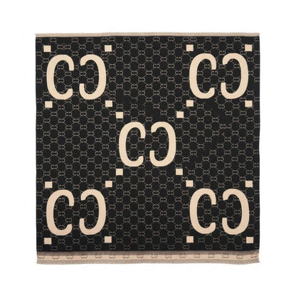 Legacy Luxe Icon Weave Wrap featuring a bold signature pattern in black and beige, perfect for stylish layering.
