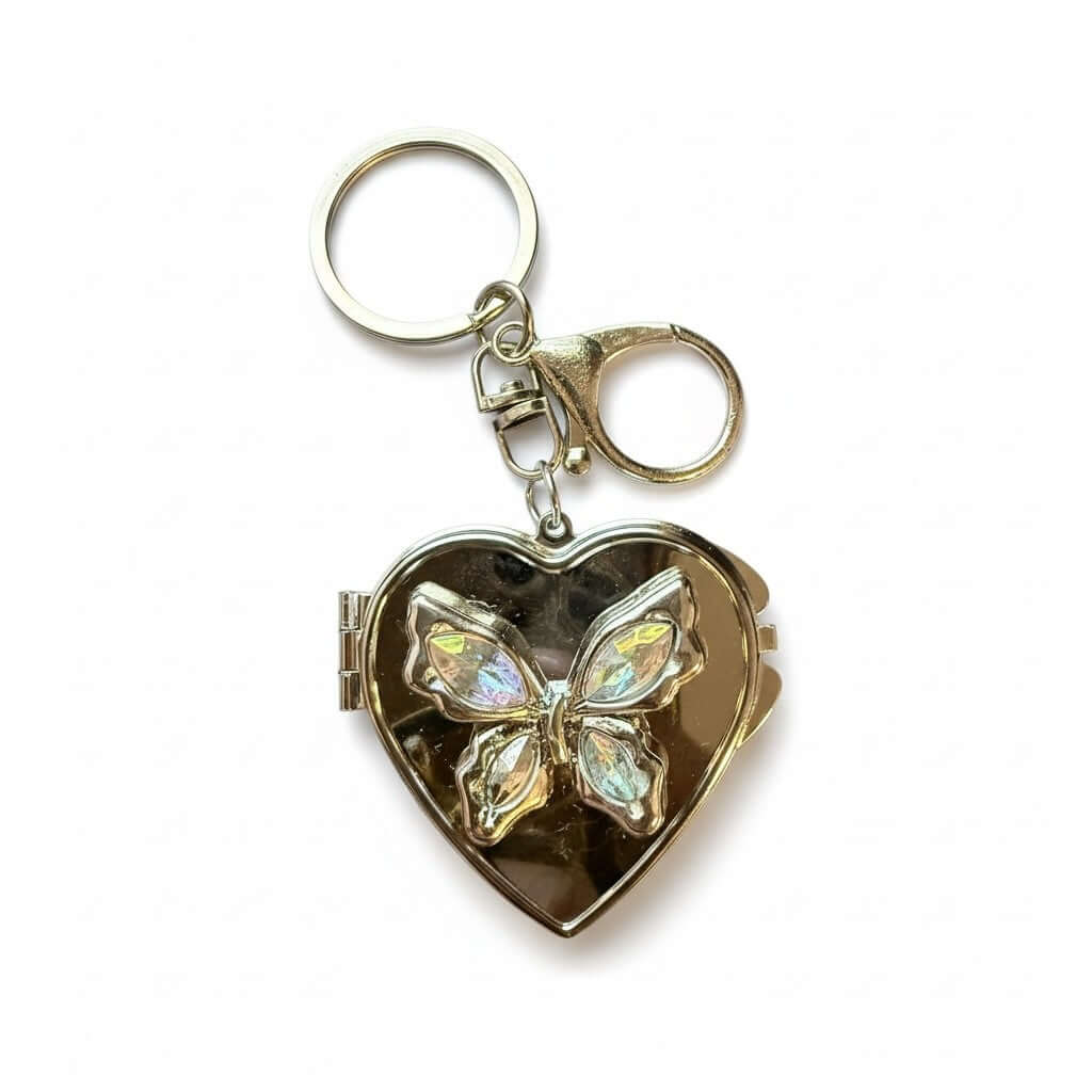 Legacy Blush Butterfly Locket Charm, heart-shaped gold charm with pink butterfly gems and dual mirror.