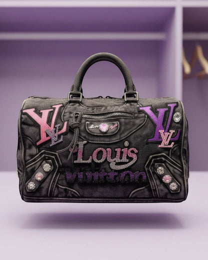 Legacy Dealz purple denim speedy bag with rhinestone  logo and  accents.