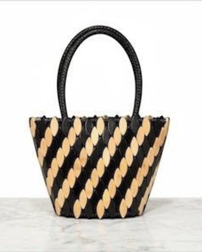Legacy Dealz Annie handcrafted tote bag in black and cream leather with wood appliqué. Bucket style with top handles.